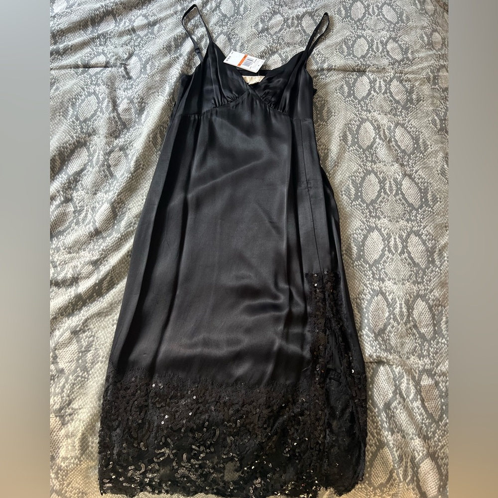 Brand new medium Micheal kors black silk dress.